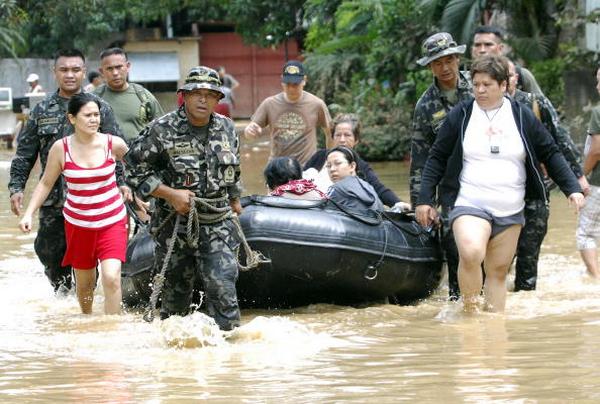 После урагана в городе Пассик на Филлипинах в Маниле (29.09.2009).   Фото: NOEL CELIS/AFP/Getty Images