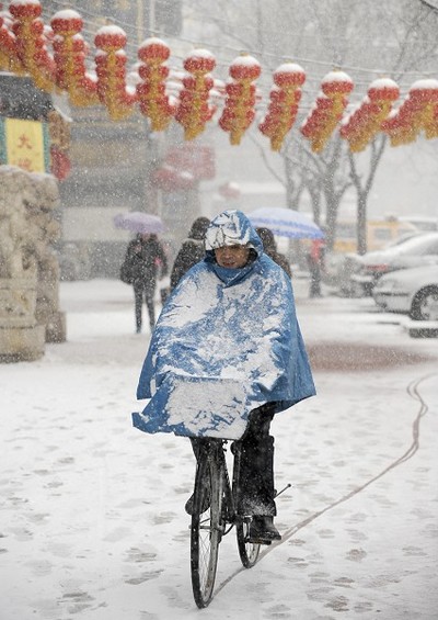 Снегопад в Пекине. 14 марта 2010 год. Фото: AFP PHOTO/ LIU Jin