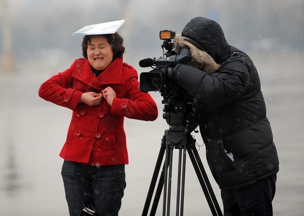 Снегопад в Пекине. 14 марта 2010 год. Фото: AFP PHOTO/ LIU Jin