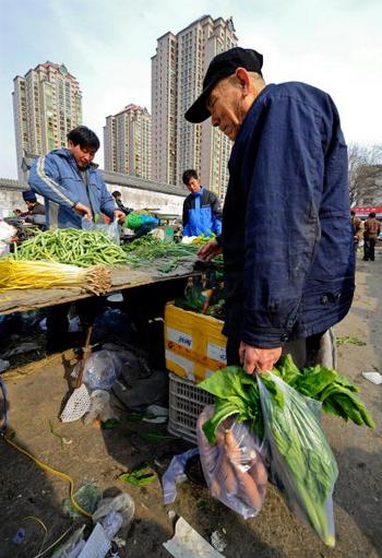 Производительность труда китайских крестьян в десятки раз ниже, чем в развитых странах. Фото: TEH ENG KOON/AFP/Getty Images