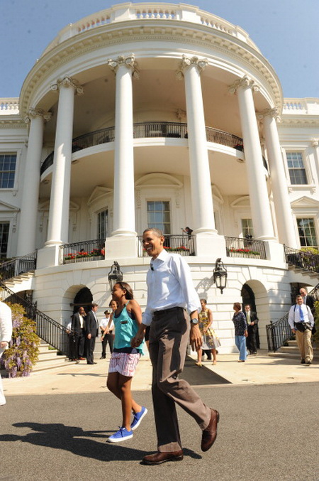 Президент Обама и Мишель Обама пригласили детей и их родителей на ежегодное катание пасхальных яиц. Фото: Chip Somodevilla/Getty Images