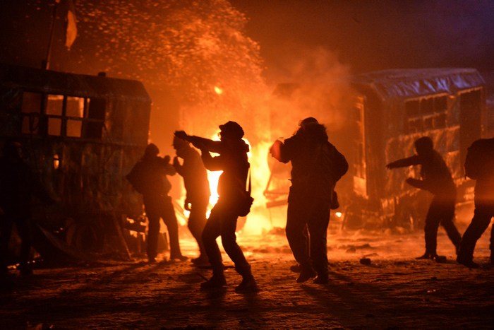 Столкновения демонстрантов с сотрудниками спецподразделения «Беркут» в центре Киева 20 января 2014 года. Фото: SERGEI SUPINSKY/AFP/Getty Images
