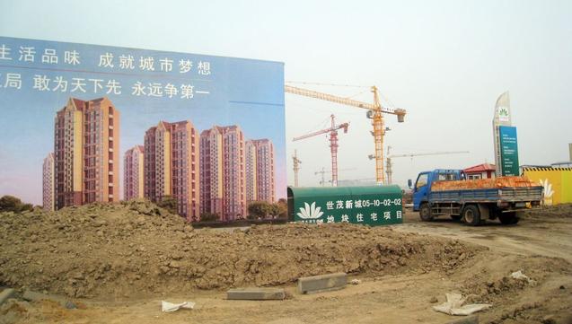 Гигантский «эко-город» должен быть построен за 10 лет в Тяньцзине. Строительство началось в 2010 году. Фото: Allison JACKSON/AFP/Getty Images | Epoch Times Россия