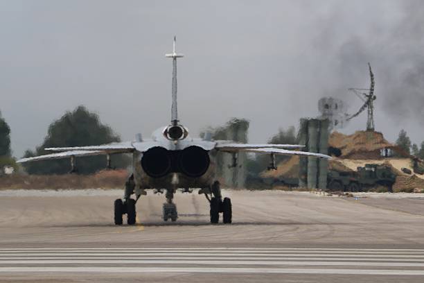 A Russian combat aircraft drives on the tarmac at the Russian Hmeimim military base in Latakia province, in the northwest of Syria, on December 16, 2015.  Russia began its air war in Syria on September 30, conducting air strikes against a range of anti-regime armed groups including US-backed rebels and jihadist groups. Moscow has said it is fighting and other 