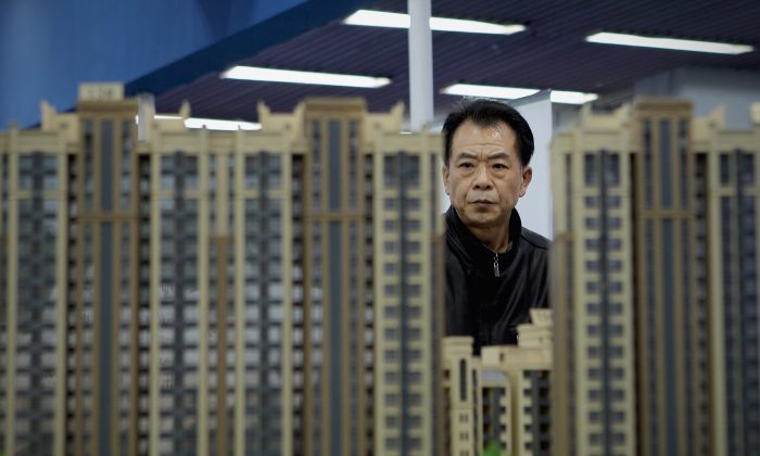 Модели недвижимости демонстрируются в Пекине 9 апреля 2011 г. (Lintao Zhang / Getty Images) | Epoch Times Россия