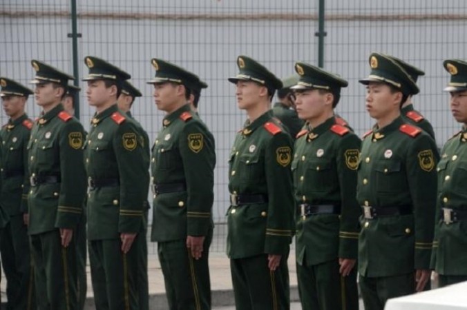15 апреля на первом заседании нового китайского КГБ Си Цзиньпин говорил главным образом о безопасности. Фото: GOH CHAI HIN/AFP/Getty Images | Epoch Times Россия