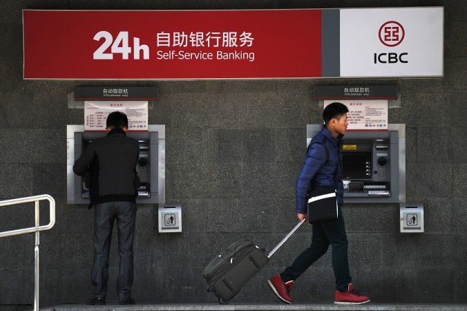 Банкомат в Пекине 25 января 2014 года. Фото: WANG ZHAO/AFP/Getty Images | Epoch Times Россия