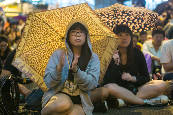 Продемократические протестующие на митинге отмечают месяц протестов в Центральном районе Гонконга 28 октября 2014 года Фото: Benjamin Chasteen/Epoch Times | Epoch Times Россия