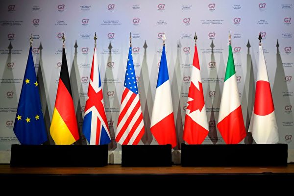 Флаги Европейского Союза, Германии, Соединённого Королевства, Соединённых Штатов Америки, Франции, Канады, Италии и Японии во время встречи по подготовке саммита G7 в Биаррице, Франция, 5 апреля 2019 года. DAMIEN MEYER/AFP via Getty Images | Epoch Times Россия
