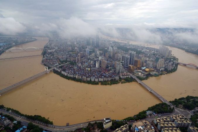 Наводнения в южном Китае. Район Гуанси. Июль 2016 года. Фото: STR/AFP/Getty Images | Epoch Times Россия